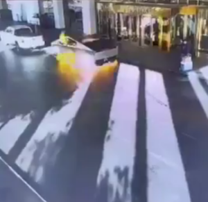 A still taken from CCTV footage showing a Tesla Cybertruck exploding outside the doors of a hotel.