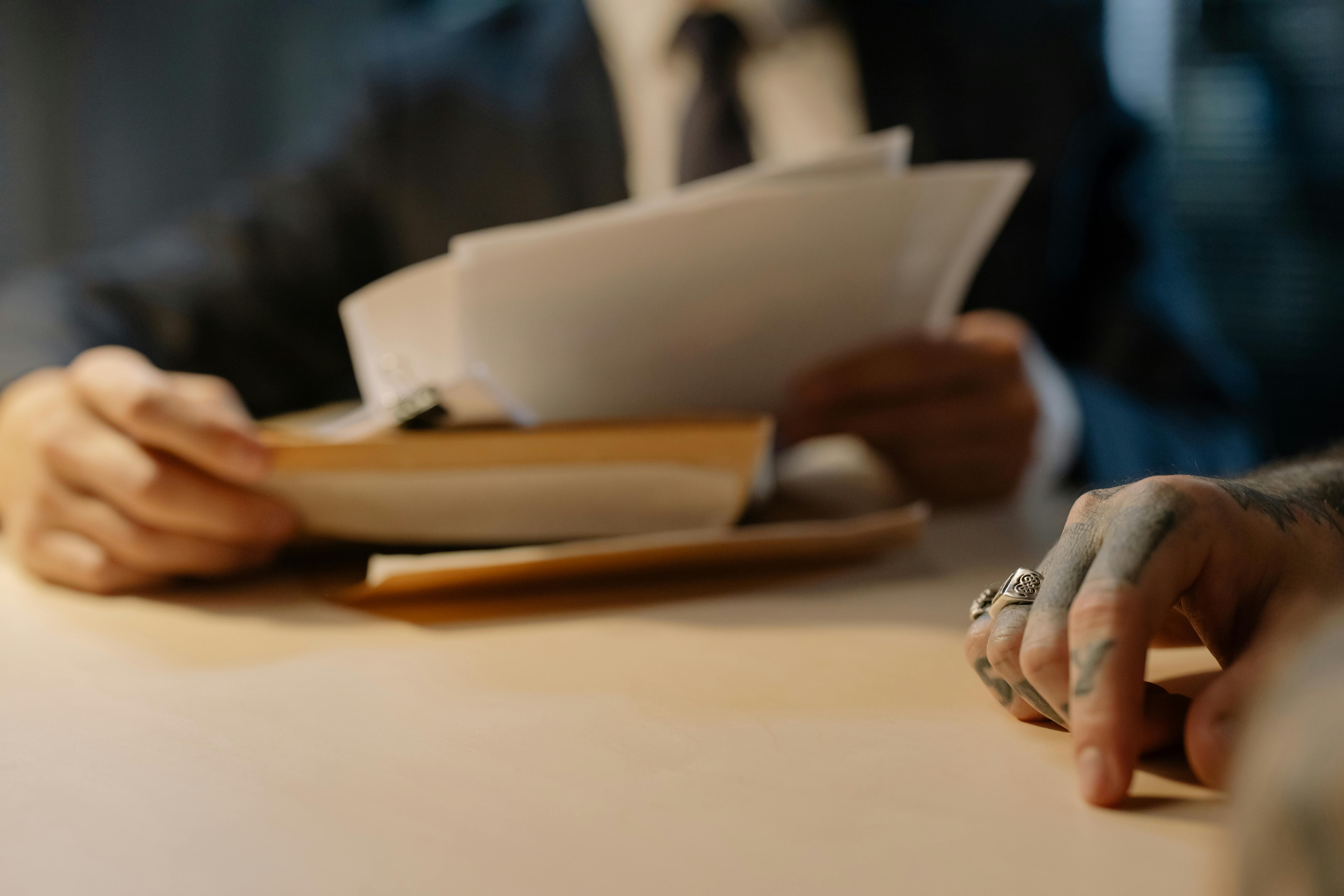 A close-up picture of someone's hands holding a paper report.